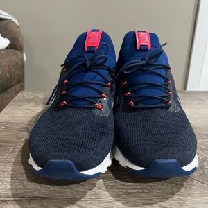 Nike running shoe blue white, and a little bit of pink